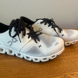 On Running White and Black Athletic Shoes